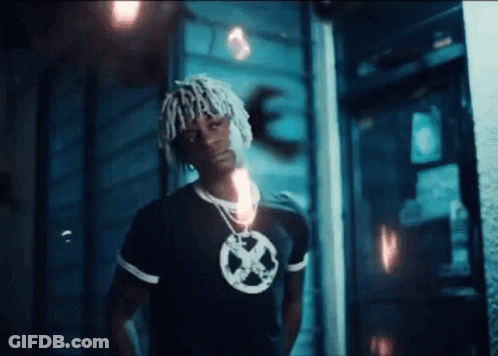 Man With Dreadlocks Wearing X-Men Shirt GIF
