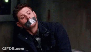 Man With Duct Tape On Mouth Wearing Tie And Jacket GIF