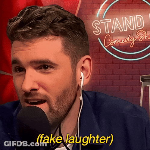 Man With Ear Buds Mic Stand Comedy Show GIF