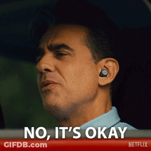 Man With Ear Buds Saying No It's Okay In Netflix Ad GIF