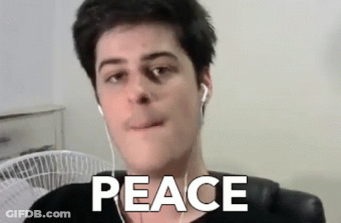 Man With Ear Buds Saying Peace GIF