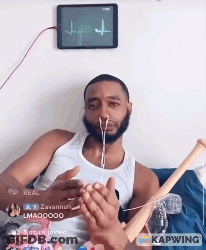 Man With Earbuds Holding Baseball Bat In Front Of Tablet Showing Heartbeat GIF