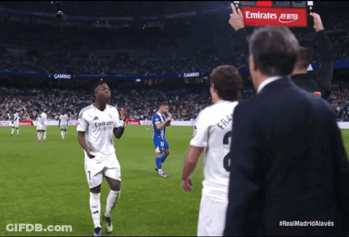 Man With Emirates Sign On Soccer Field GIF