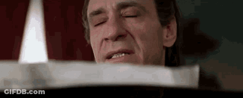 Man With Eyes Closed And Candle GIF