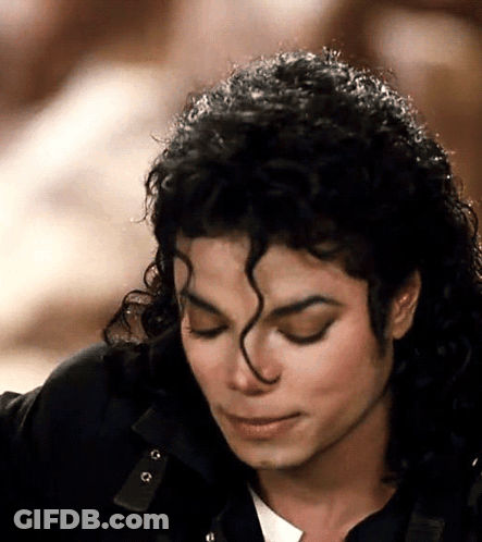 Man With Eyes Closed And Curly Hair GIF
