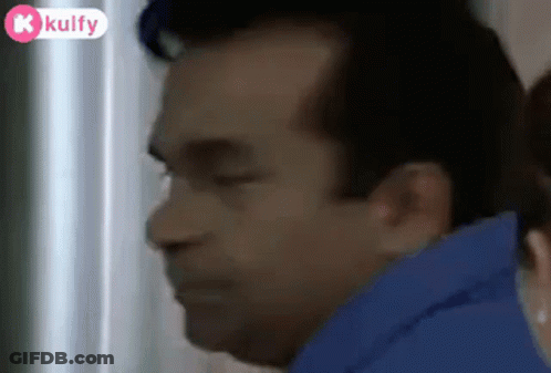 Man With Eyes Closed And Woman Behind Him GIF