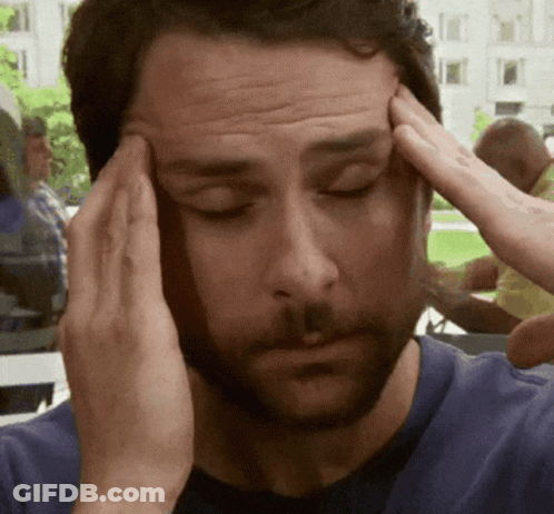 Man With Eyes Closed Holding Head GIF