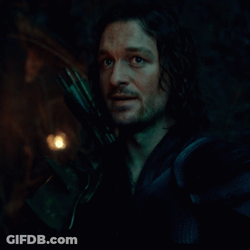 Man With Eyes Closed Holding Sword GIF