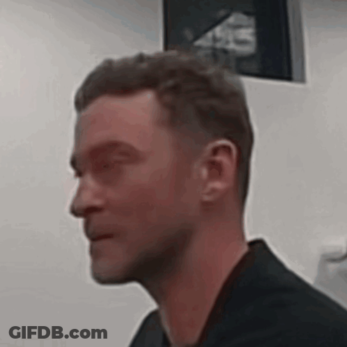 Man With Eyes Closed In Black Shirt GIF
