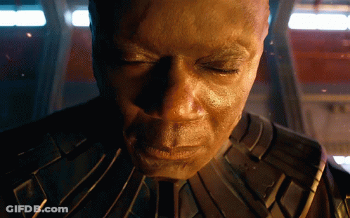 Man With Eyes Closed In Dark Room GIF