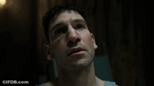 Man With Eyes Closed In Dark Room GIF