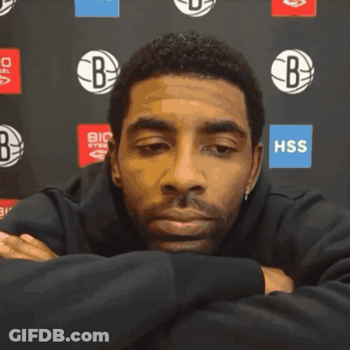 Man With Eyes Closed In Front Of HSS Sign GIF