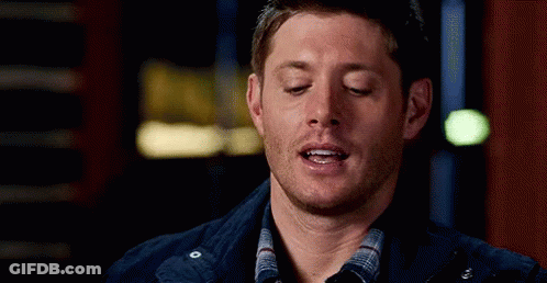 Man With Eyes Closed In Plaid Shirt And Blue Jacket GIF