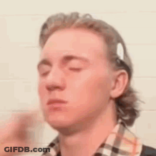 Man With Eyes Closed In Plaid Shirt And Headband GIF