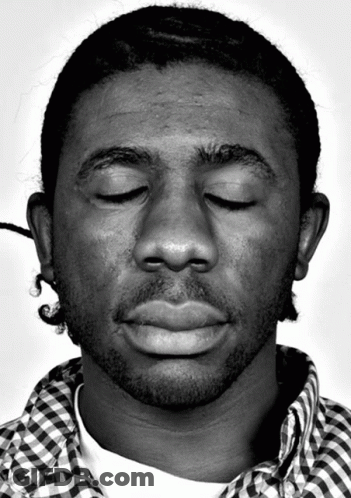 Man With Eyes Closed In Plaid Shirt GIF