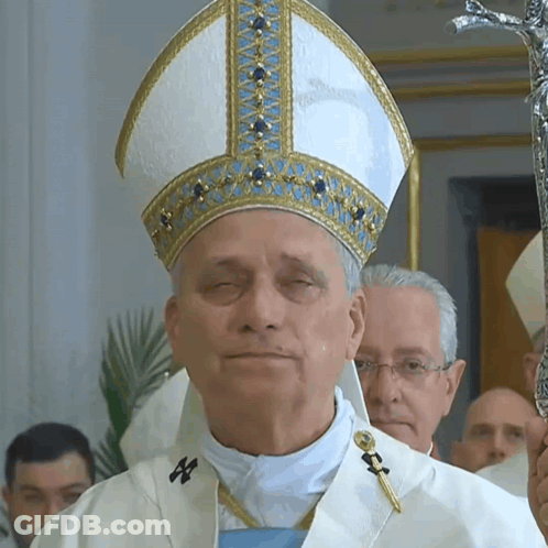 Man With Eyes Closed In White And Gold Hat GIF