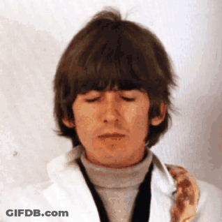 Man With Eyes Closed In White Jacket Tie GIF