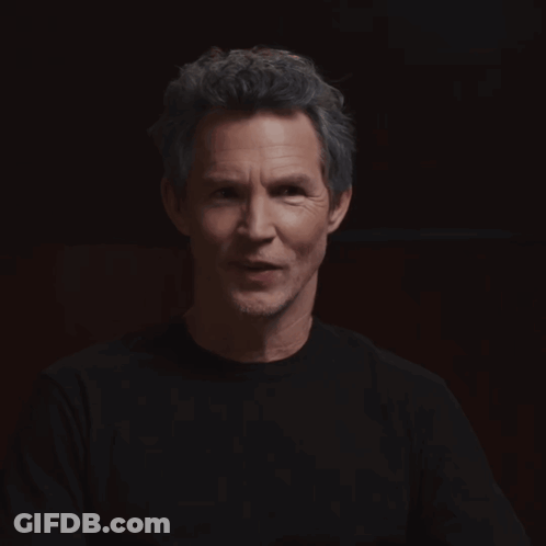 Man With Eyes Closed Looking At Camera GIF