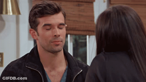 Man With Eyes Closed Looking At Woman GIF