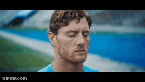 Man With Eyes Closed On Field GIF