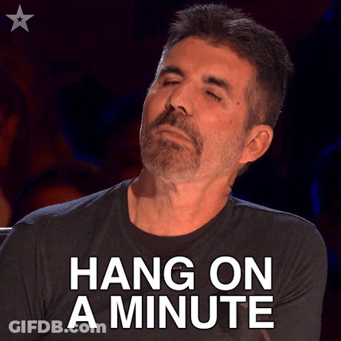 Man With Eyes Closed Saying Hang On A Minute GIF