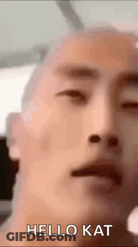 Man With Eyes Closed Saying Hello Kat GIF