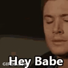 Man With Eyes Closed Saying Hey Babe GIF