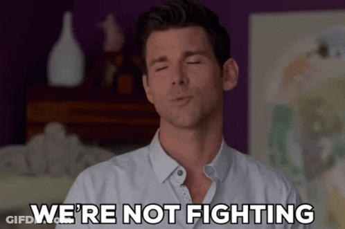 Man With Eyes Closed Saying We're Not Fighting GIF
