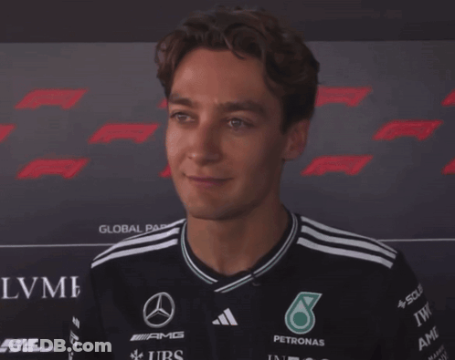 Man With Eyes Closed Wearing AMG Petronas Shirt GIF