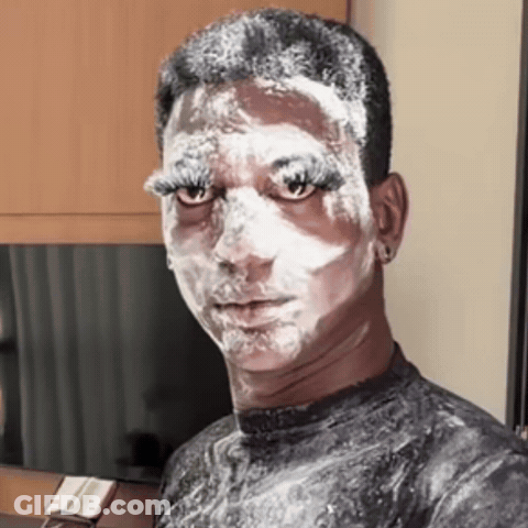 Man With Face Covered In White Powder GIF