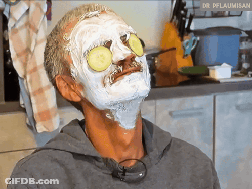 Man With Face Mask And Cucumber Slices Dr Pflaumisan GIF