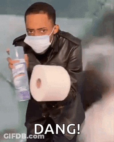 Man With Face Mask Holding Toilet Paper And Spray Bottle GIF