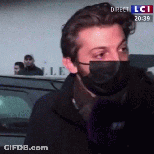 Man With Face Mask Interviewed On LCI GIF