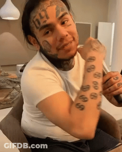 Man With Face Tattoo And 666 On Arm GIF