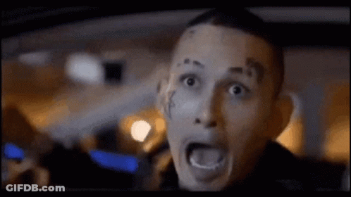 Man With Face Tattoo Driving Car Mouth Open GIF