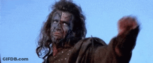 Man With Face Tattoo Fist In Air Blue Sky GIF