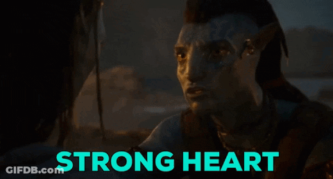 Man With Face Tattoo Looks At Another Saying Strong Heart GIF