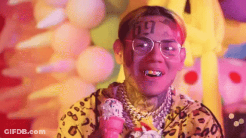 Man With Face Tattoo Smiling Holding Ice Cream GIF