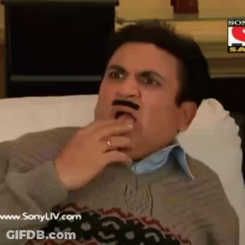 Man With Fake Mustache Sitting On Couch Eating GIF