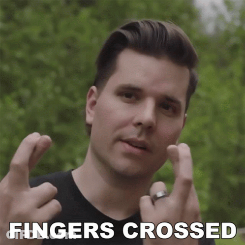 Man With Fingers Crossed Saying Fingers Crossed GIF