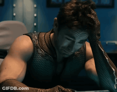 Man With Fishnet Glove Holding Head GIF