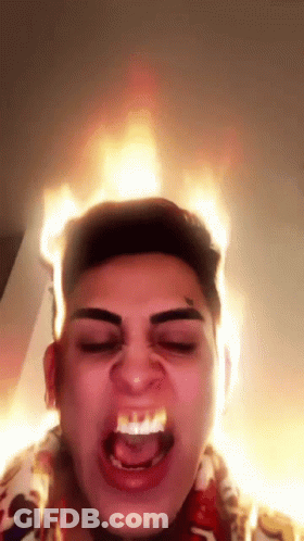 Man With Flames Coming Out Of Head Making Funny Face GIF