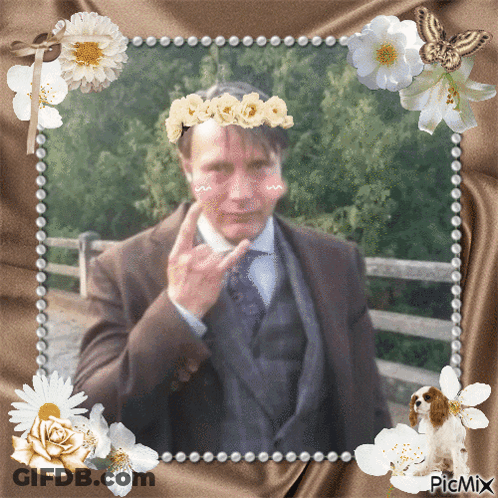 Man With Flower Crown Amid Flowers And Butterfly GIF