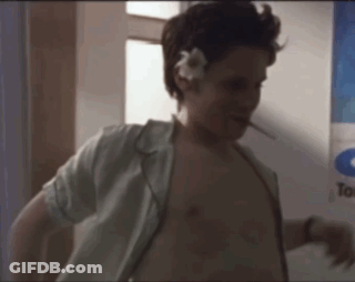 Man With Flower In Hair And Cigarette GIF