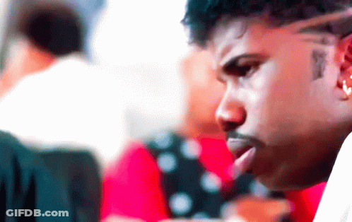 Man With Forehead Tattoo Looking GIF