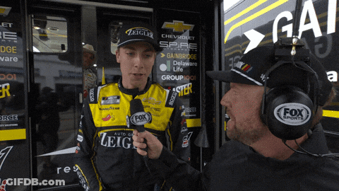 Man With Fox Sports Headset Talking To Race Car Driver GIF