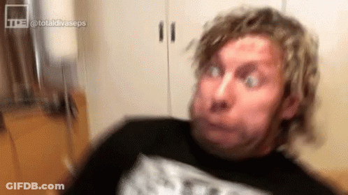 Man With Funny Face Eyes Closed Hair Blowing GIF