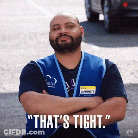 Man With Garrett Name Tag Crosses Arms GIF