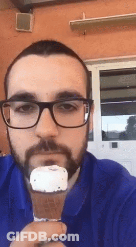 Man With Glasses And Beard Eating Ice Cream GIF