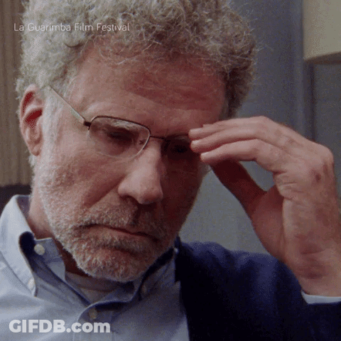 Man With Glasses And Beard Eating With Blue Spoon GIF